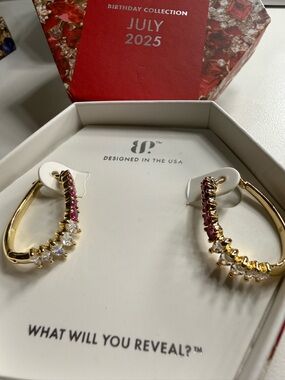 Ruby and cubic zirconia on gold earrings.